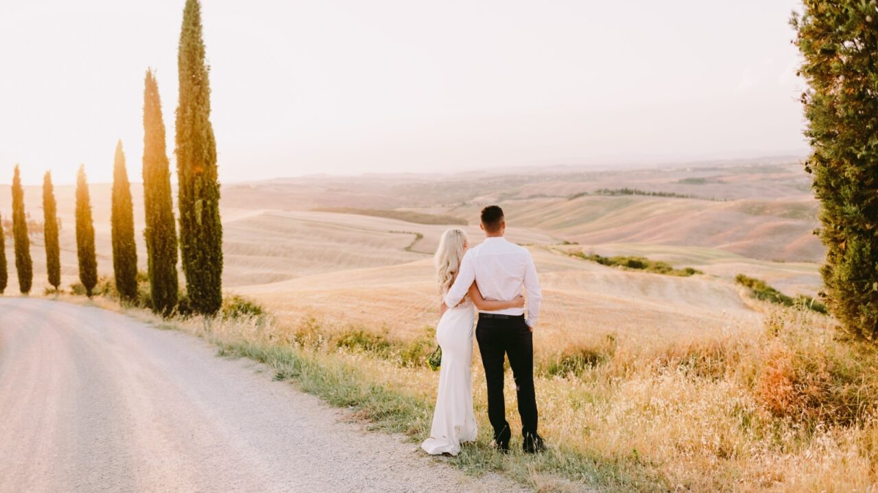 Honeymoon couple travel Tuscany in Italy. Couple relax in Tuscany. Italy travel.