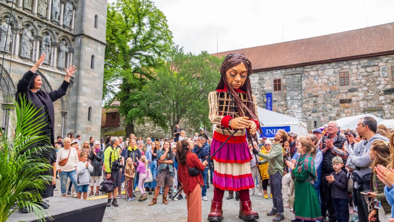 Trondheim, Norway - July, 28, 2023: Little Amal is a 3.5-metre partly-animatronic giant puppet. Here during International OLAVSFEST festival. Doll is an international symbol of child refugees. Europe