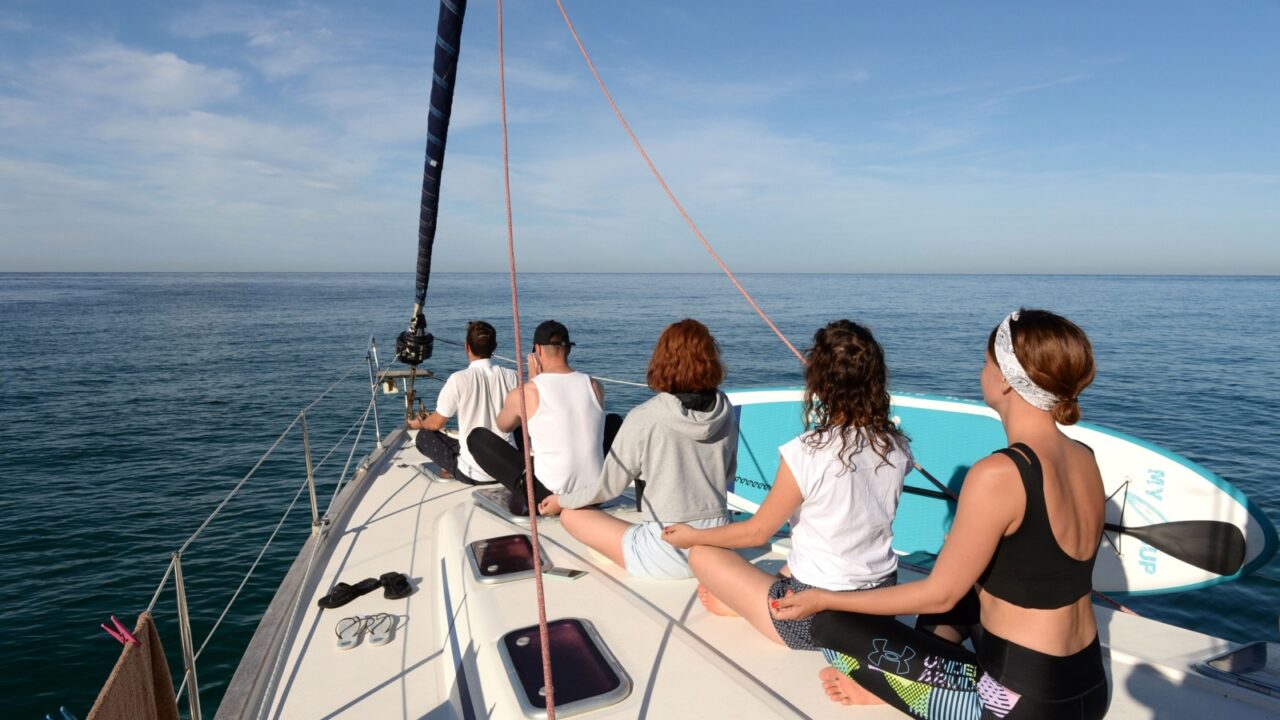 REPUBLIC OF CRIMEA - SEPTEMBER 10, 2021:Morning meditation on a yacht in the Black Sea