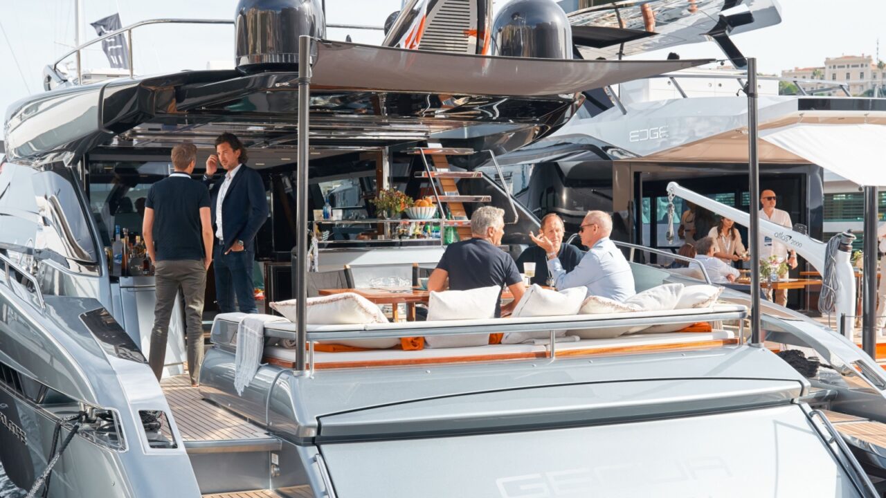 Monaco, Monte Carlo, 29 September 2022 - Invited wealthy clients inspect mega yachts at the largest fair exhibition in the world yacht show MYS, port Hercules, yacht brokers, sunny weather