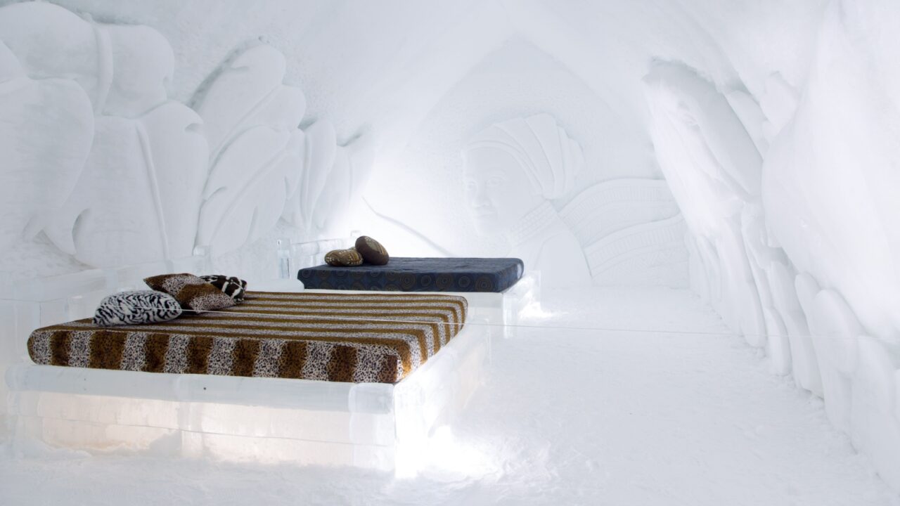 Saint-Gabriel-de-Valcartier, Quebec, Canada, March 7, 2020 - Spectacular bas-reliefs of African woman and leaves sculpted on a bedroom wall in the world-renowned seasonal Ice Hotel
