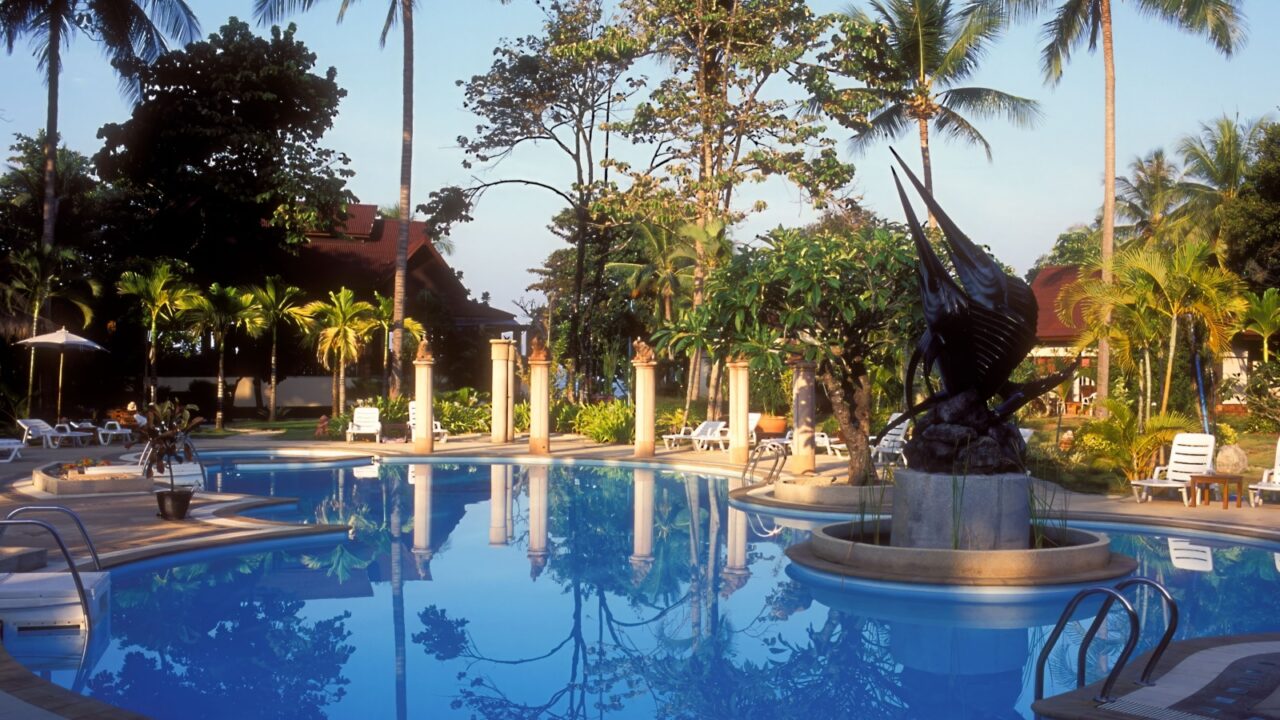Ko Lanta, Thailand JANUARY 23, 2007: Pool area at Lanta Sand Resort and Spa. Hotel by the tropical Andaman Sea. Art, artwork in and around the pool.