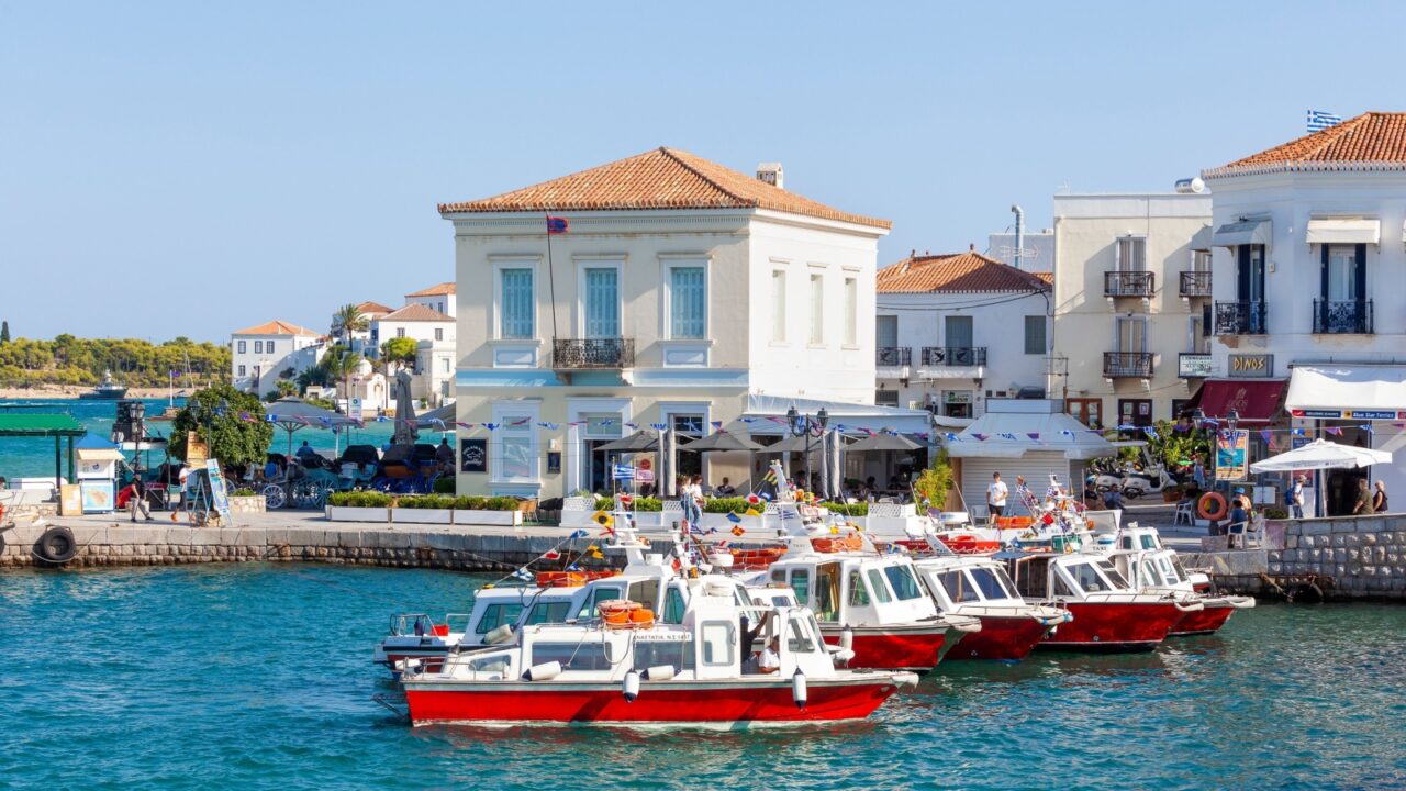 SPETSES, GREECE - 09.09.2023: Sea taxis at the small port of Dapia, in Spetses island, Greece, on the day of the Armata, the most popular local festival.