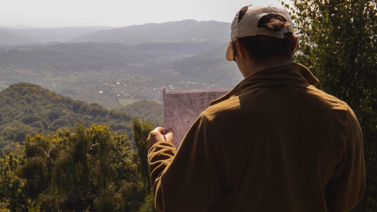 Traveler holding a map in a Georgia town