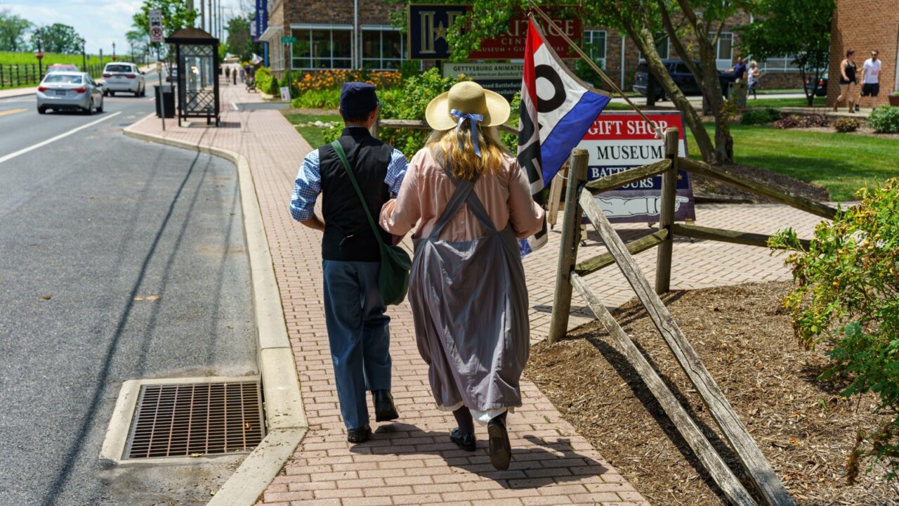 Gettysburg, PA, USA - July 4, 2021: Civil War Reenactors walking near the Gettysburg Heritage Center.