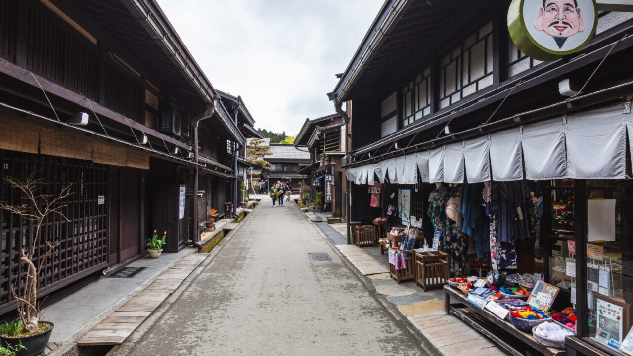 Nagano, Japan - April 06 2023: Charming street in a traditional Japanese village, lined with historic wooden houses and shops selling local crafts and souvenirs. A peaceful scene showcasing Japanese