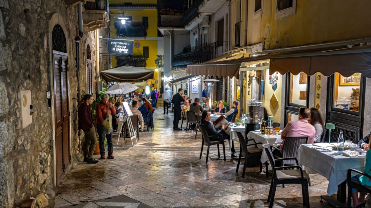 TAORMINA, ITA - MAY 25, 2023: Restaurants in Taormina, in the Metropolitan City of Messina, on the east coast of Sicily, Italy, in the night