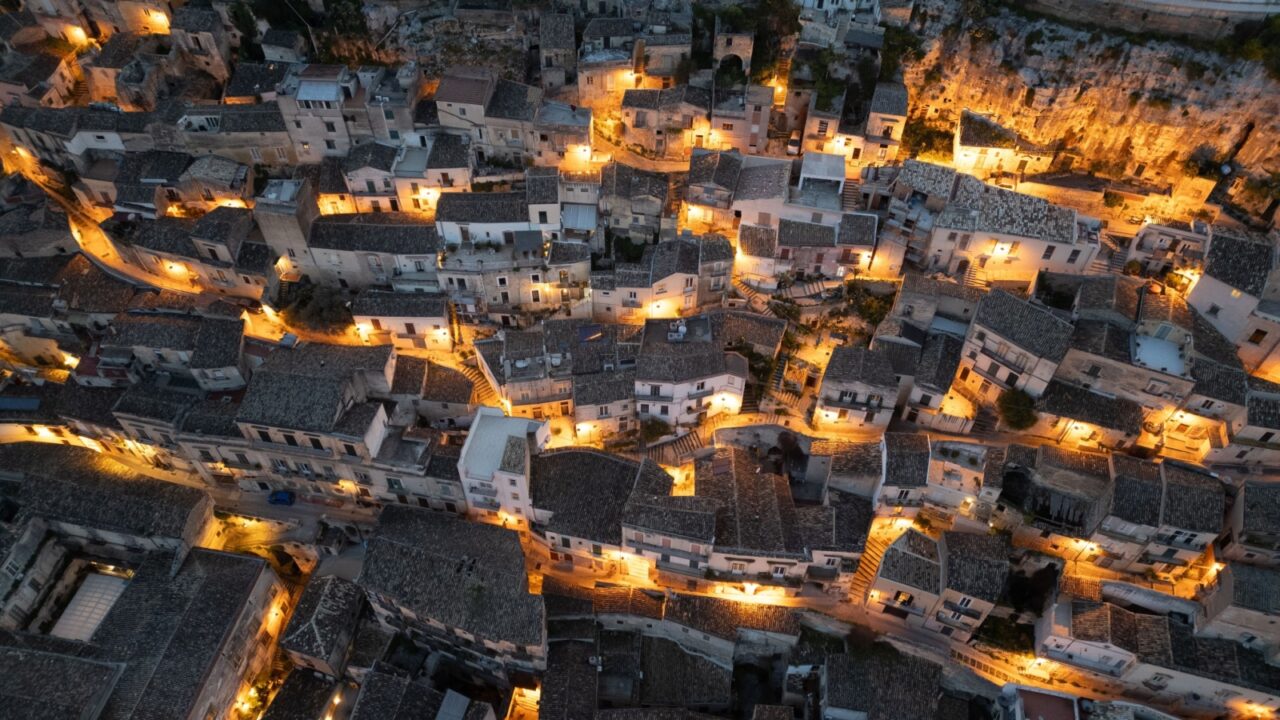 Modica from above – a baroque jewel in Sicily, famous for its chocolate, winding alleys, and breathtaking hillside views. A timeless city best admired from the sky