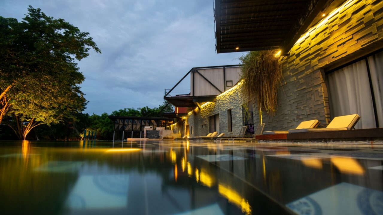 Modern resort view with wide swimming pool in Kanchanaburi, Thailand