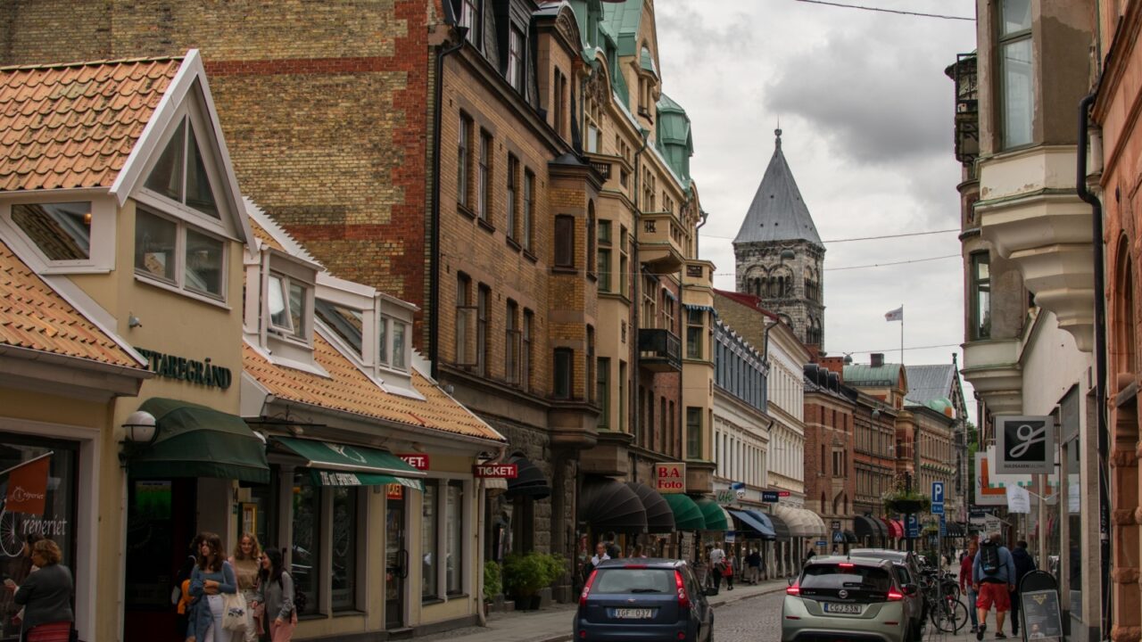 Lund, Sweden - August 28 2020: Picture from the main cobble stone streets of Lund, surrounded by small shops and restaurants.
