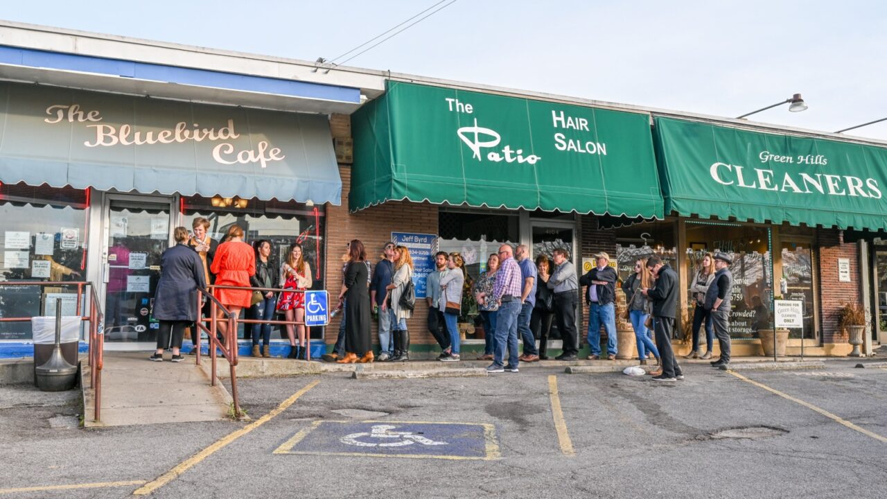 NASHVILLE, TN, USA - MARCH 24, 2019: People queue outside world famous Bluebird Cafe. This music club opened in 1982 and features acoustic music by its composers.