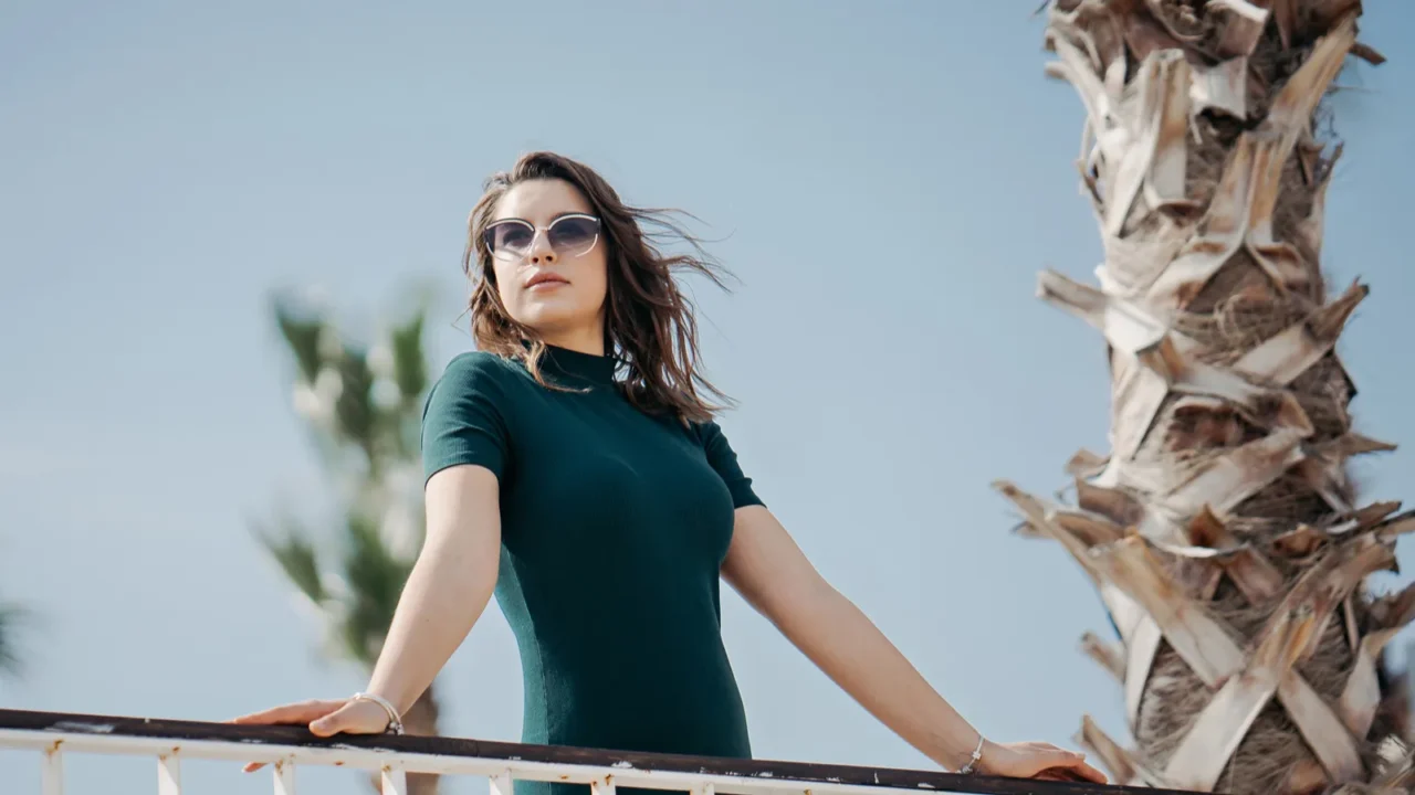 a beautiful young brunette girl is walking in the city