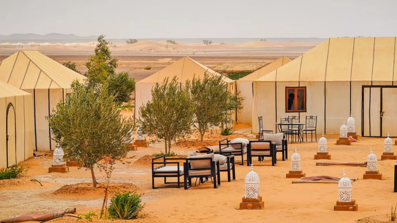 a panoramic view of a glamping site in merzougha morocco