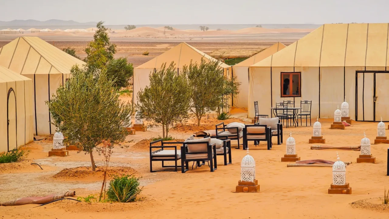 a panoramic view of a glamping site in merzougha morocco