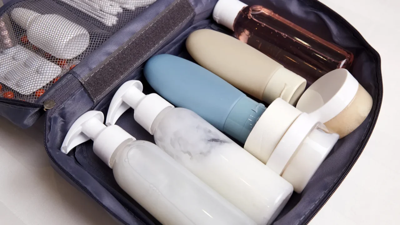 a toiletry bag is open on a flat surface showcasing
