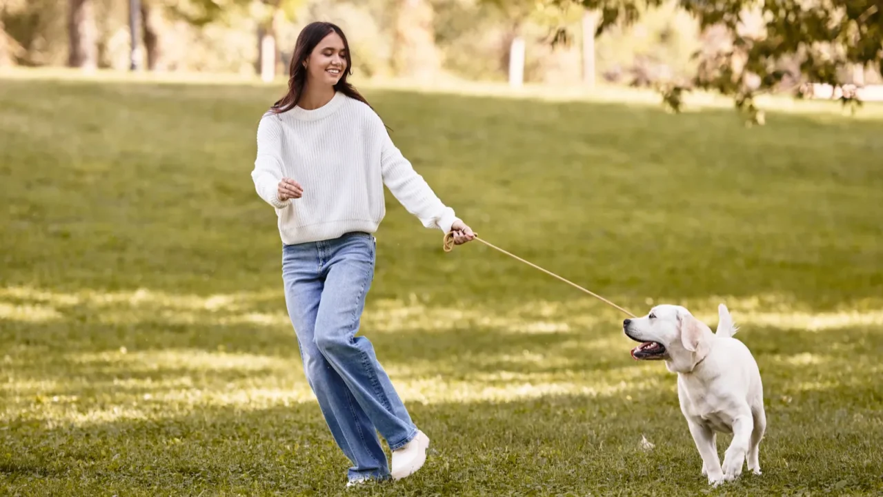 a young woman enjoys a lively walk in a park