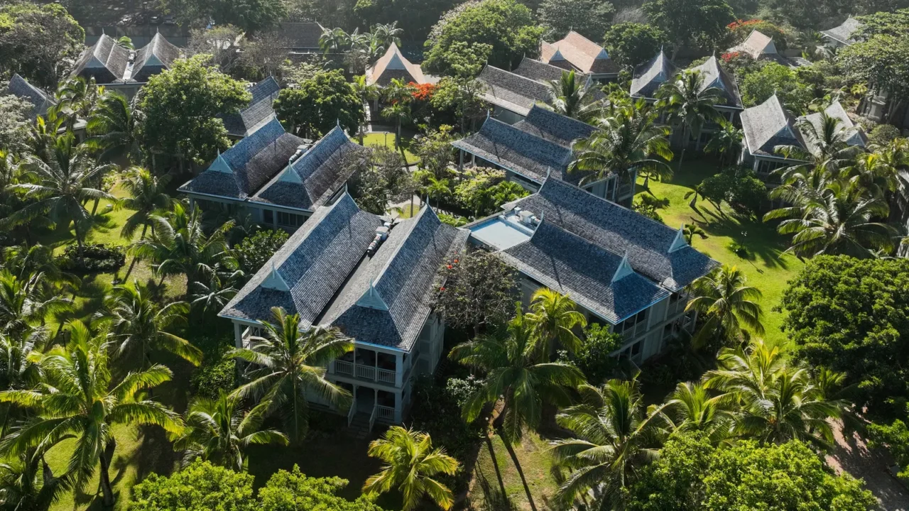 aerial view of a tropical resort nestled in dense greenery