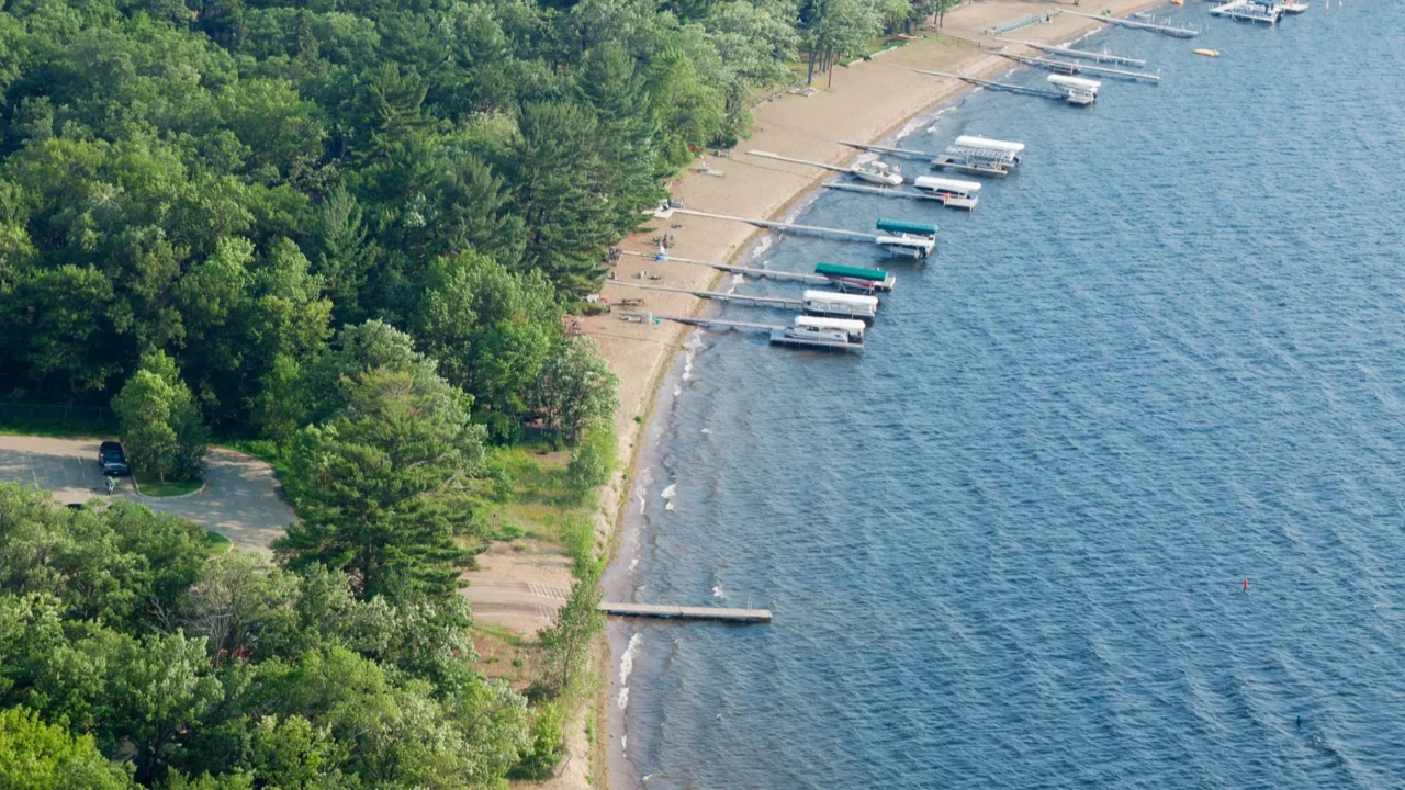 aerial view of lakeshore with docks and boats in minnesota