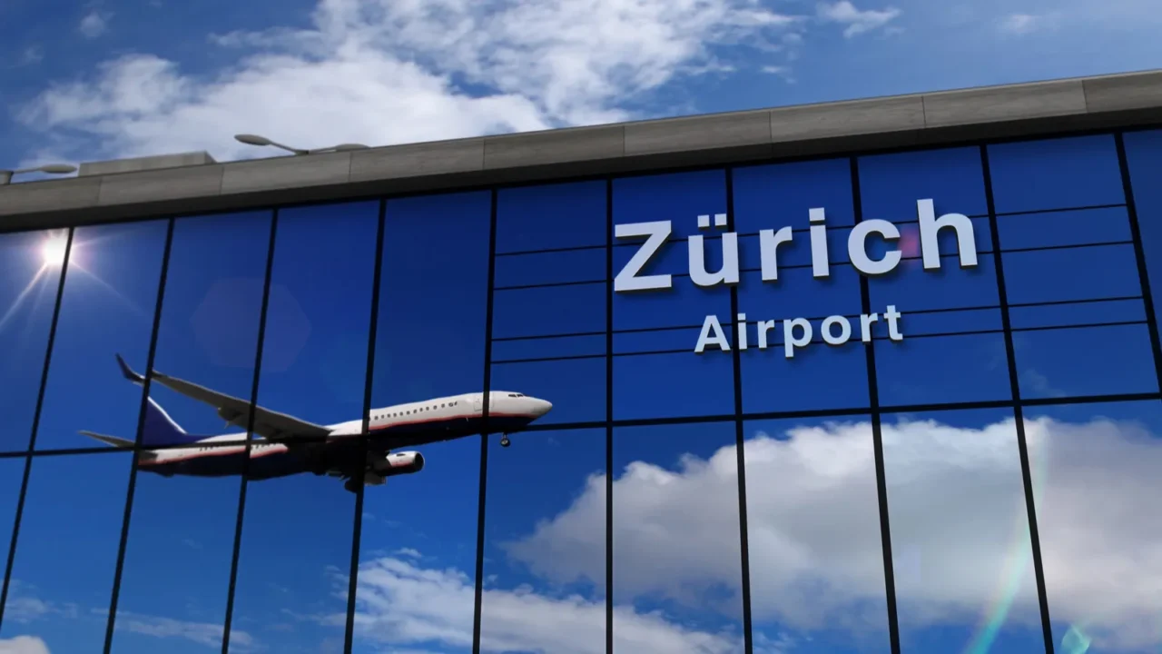airplane landing at zurich switzerland mirrored in terminal