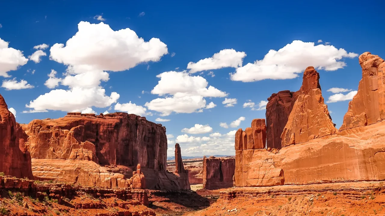 arches national park landscape view with blue sky and white