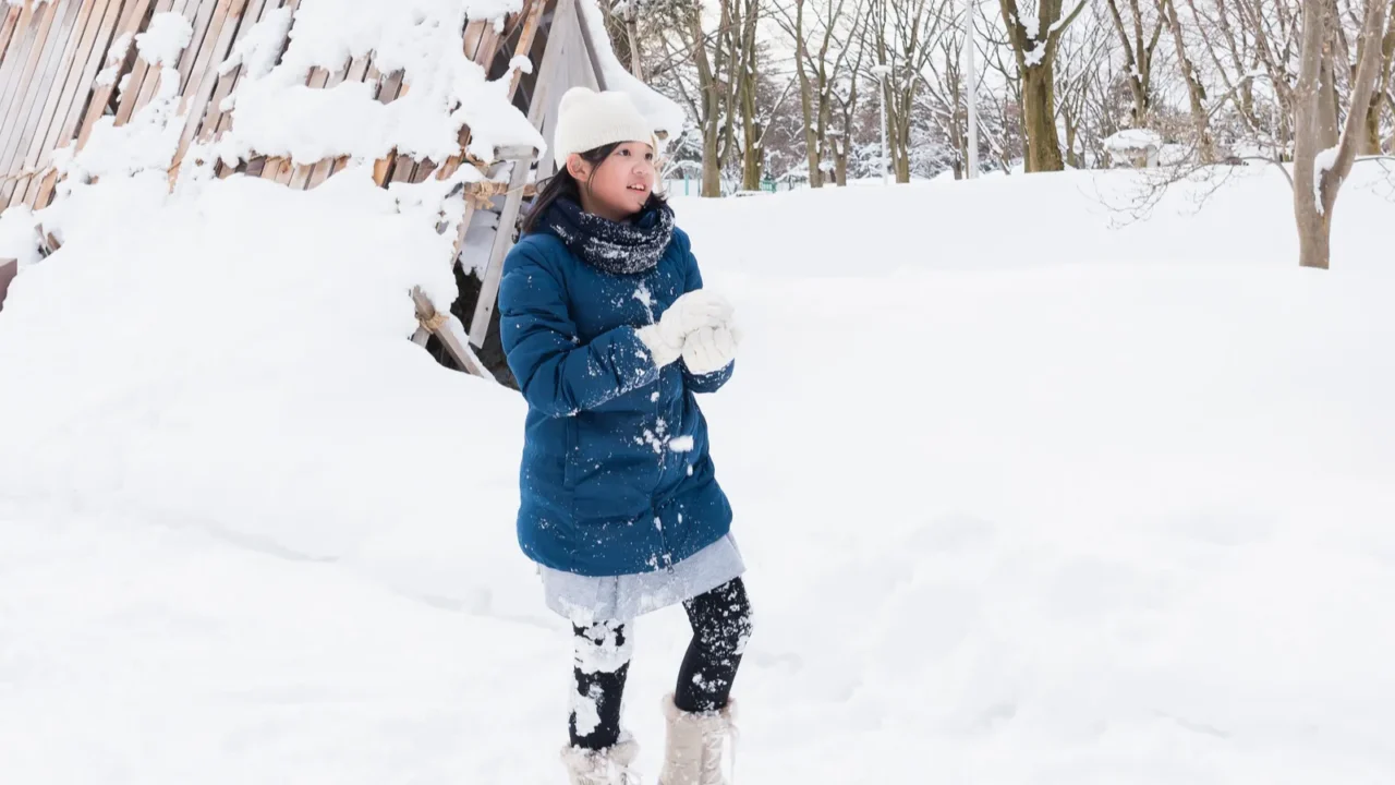 asian girl playing snow