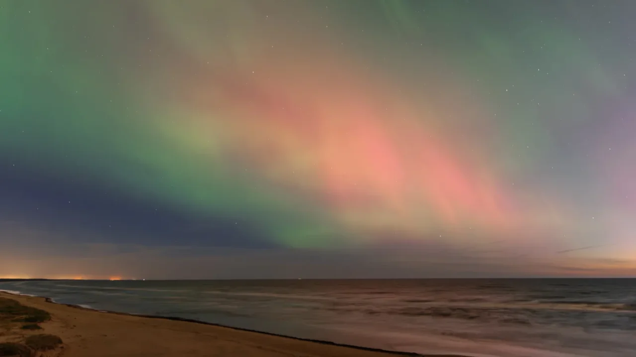 aurora borealis northen lights on the baltic sea beach in