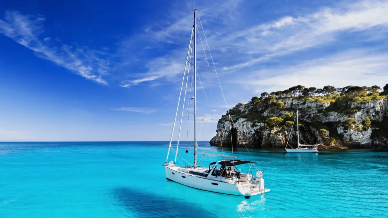 beautiful beach with sailing boat yacht menorca island spain yachting