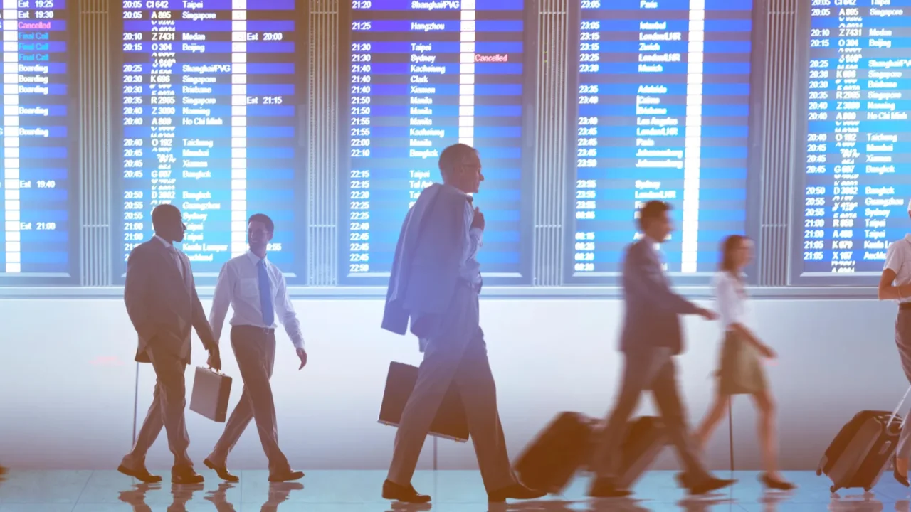business people walking in airport