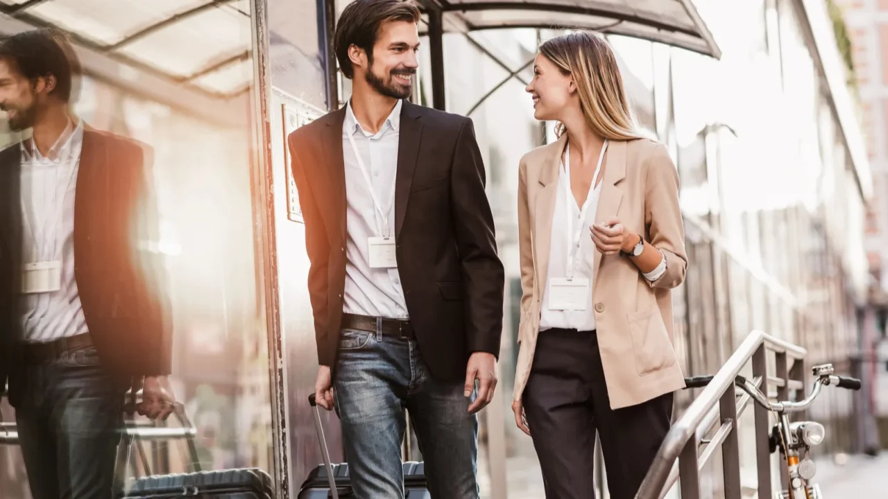 businessman and businesswoman confidently walking through the urban city district