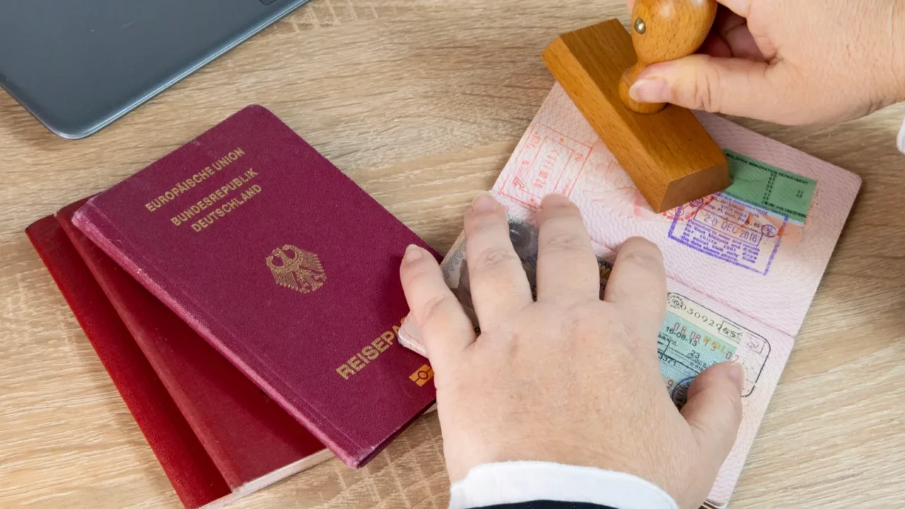 closeup of female border patrol officers meticulously inspecting foreign passports