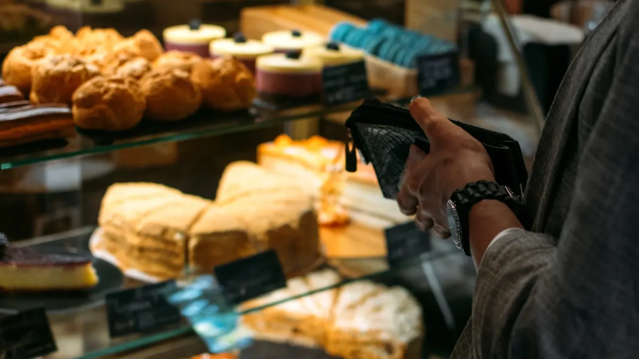 confectionery customer client in sweetshop pastryshop back view of young