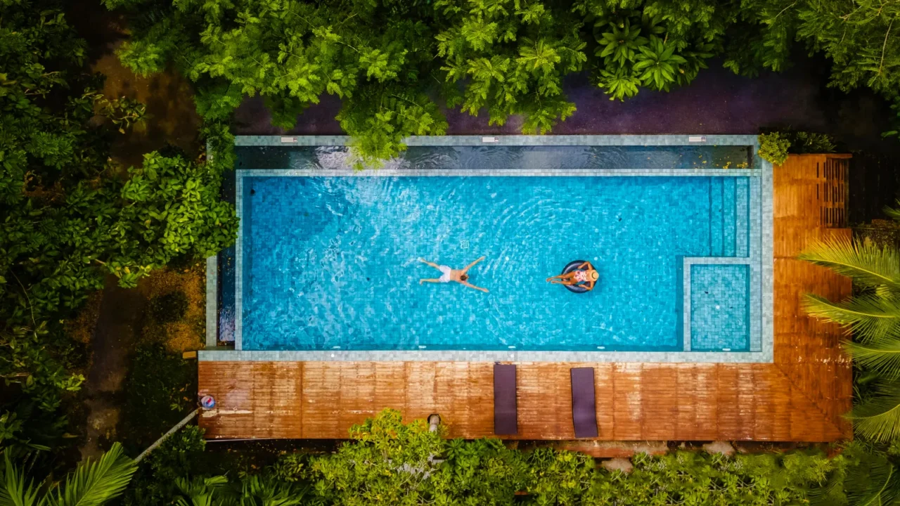 couple of men and women in a swimming pool in