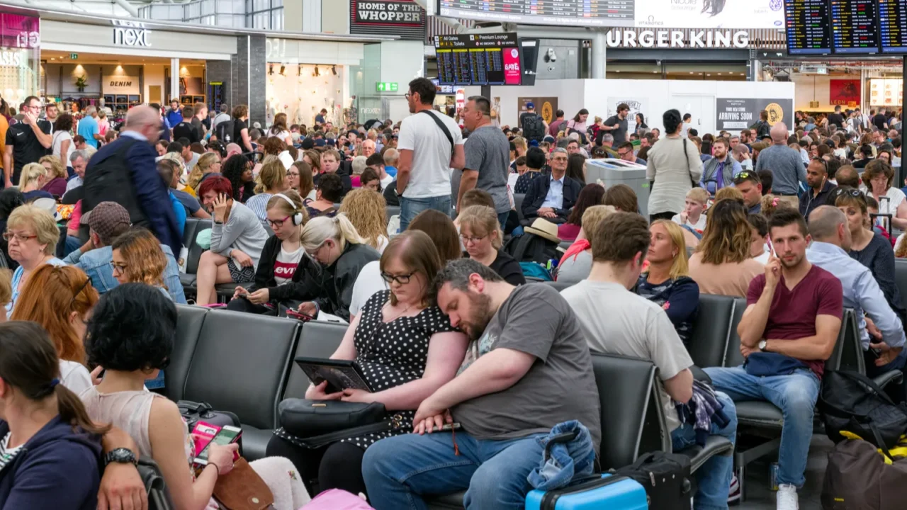 departure hall full of people london