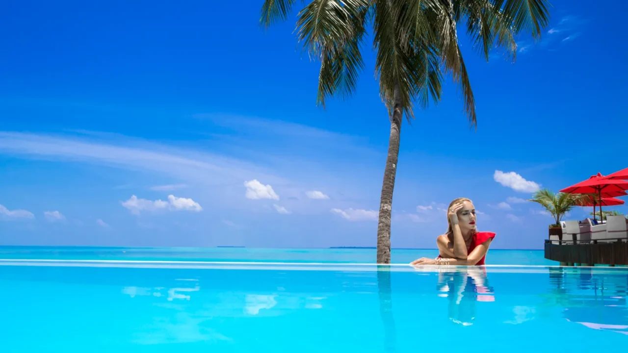 elegant sexy woman in the red bikini on the suntanned