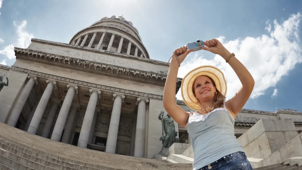 female tourist taking photos in cuba