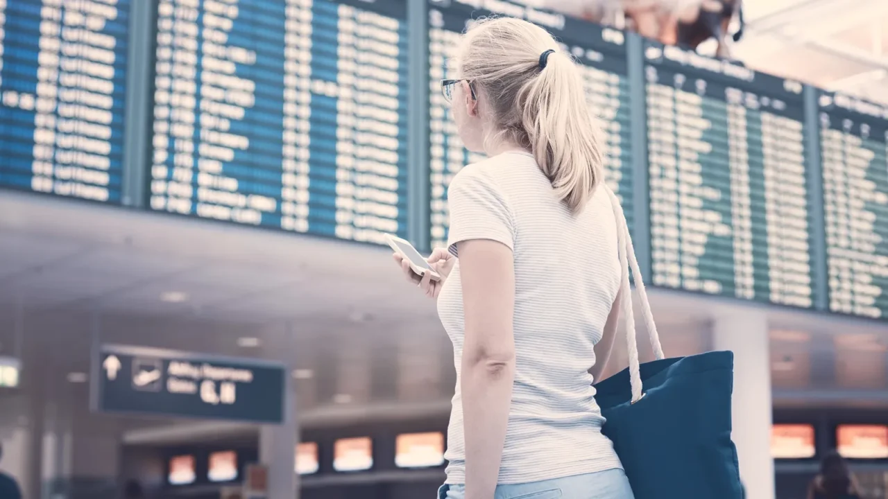 girl near airline schedule