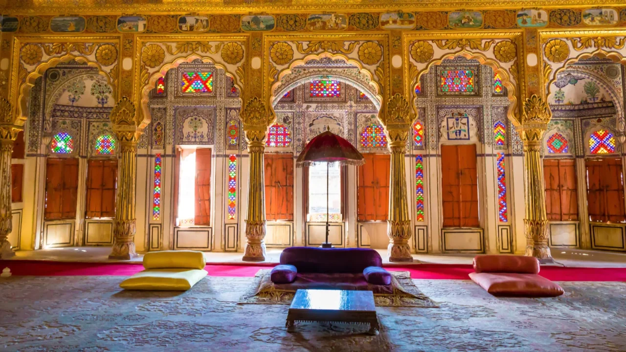 golden royal palace room with architectural details and carvings at