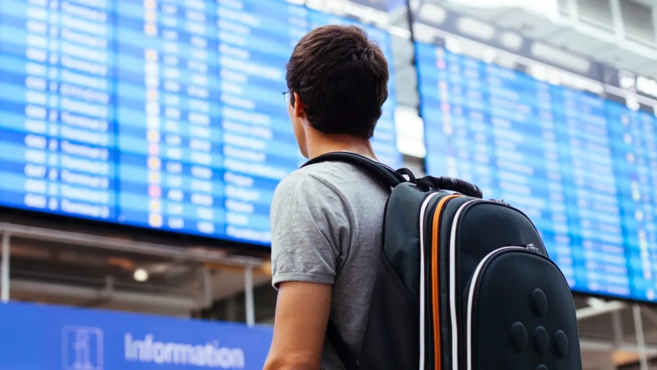 guy near airline schedule