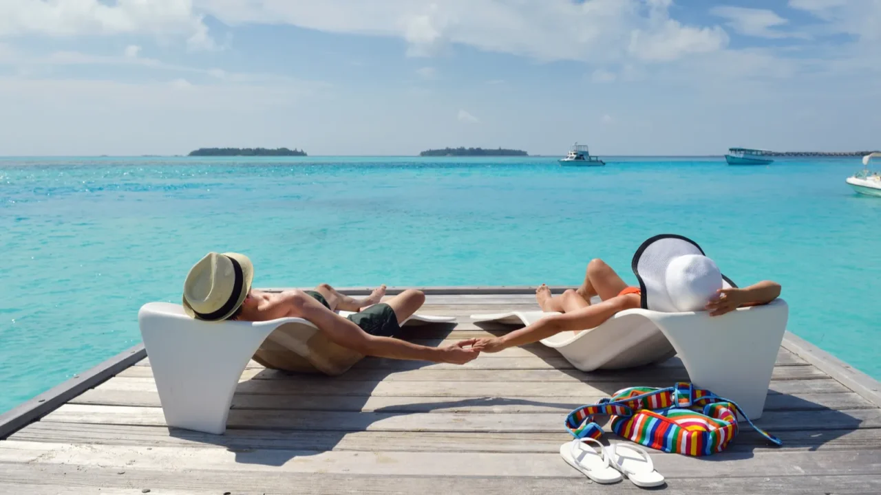 happy young couple have fun on beach