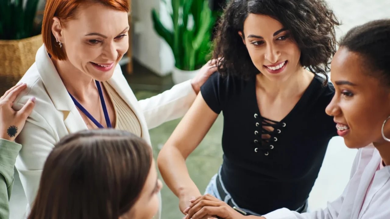 high angle view of positive redhead psychologist and diverse group