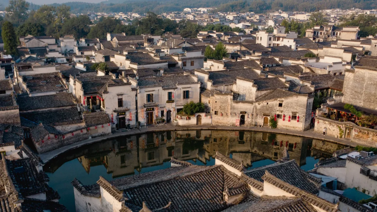 historic village features traditional chinese buildings with ornate rooftops surrounding