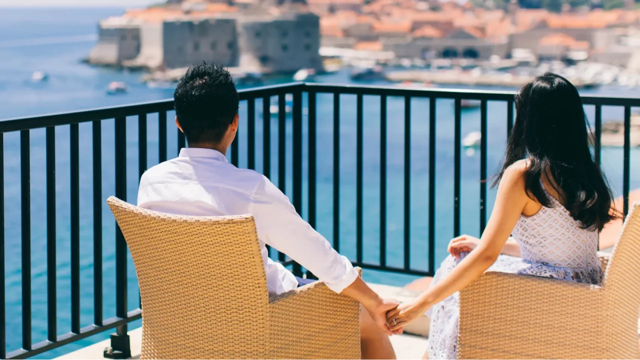 honeymoon couple on vacation in europe with sea view