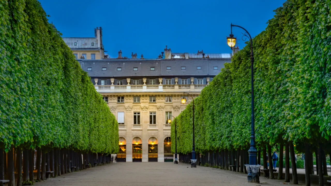 house and garden in palaisroyal palace illuminated in evening