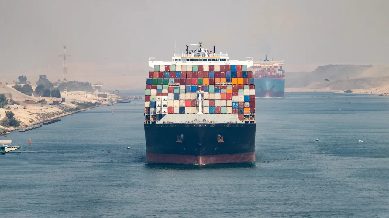 huge cargo ships navigate through suez canal shipping canal in