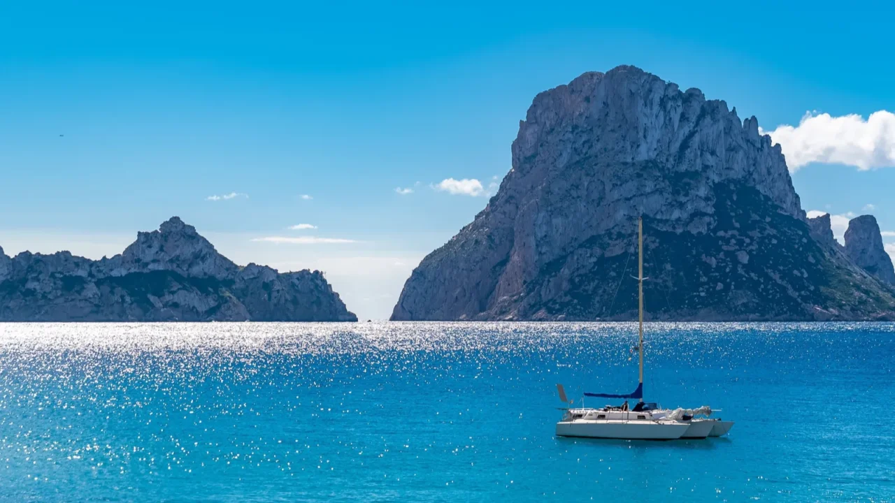 ibiza cala dhort beach beautiful sunny seascape with a sailboat