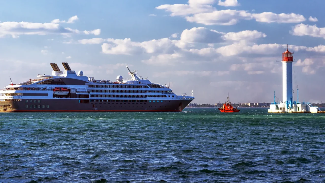 lighthouse and sea cruising liner