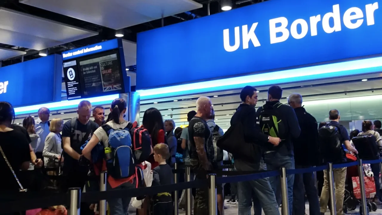 london uk  august 24 2018 air travelers queue at