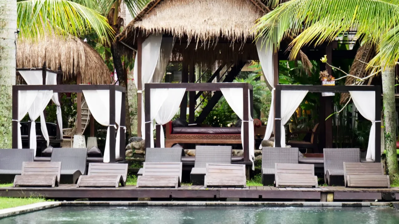 luxury hotel with swimming pool and sunbeds to relax surrounded