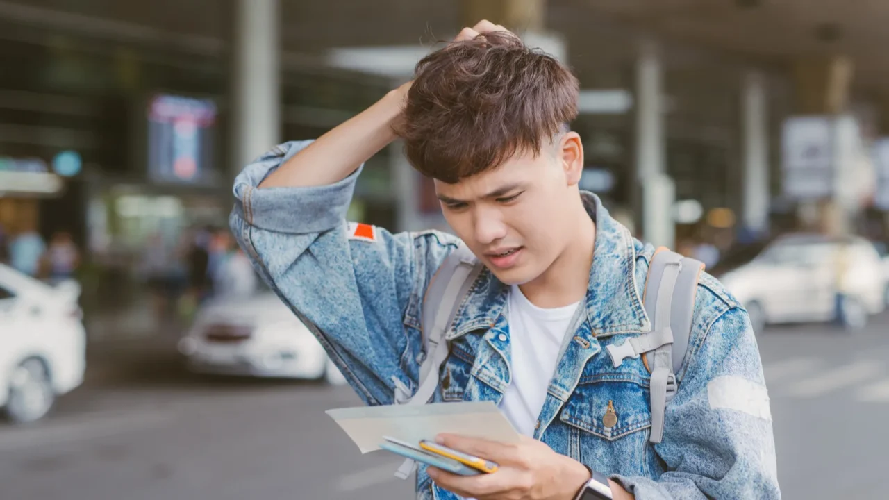 man holding his head