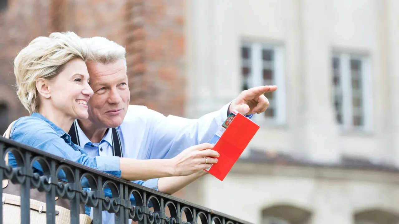 man showing something to woman